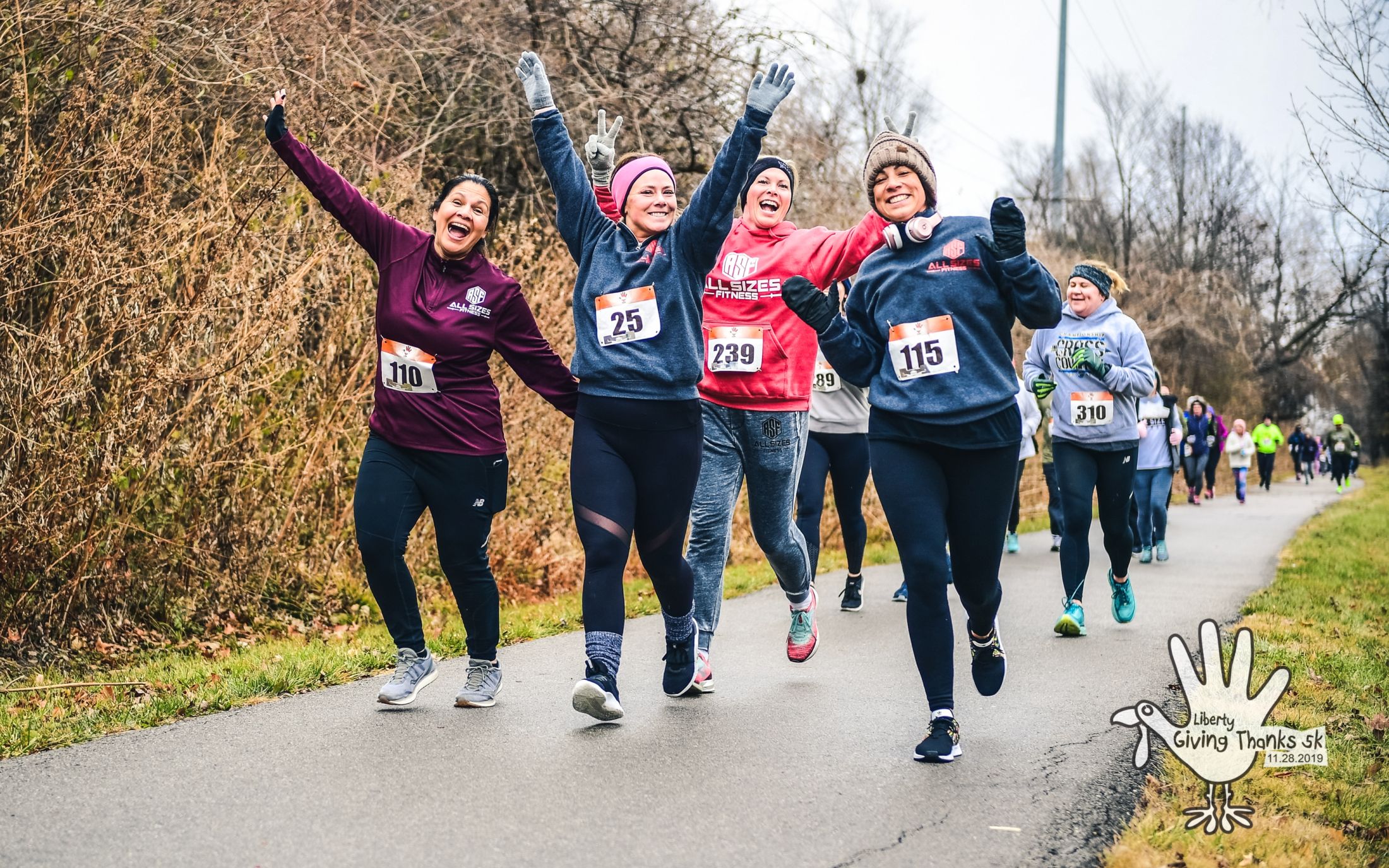 Liberty Giving Thanks group of runners arms raised